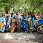 Group photo of people wrapped in star blankets.