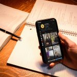 hand holding mobile phone with tiktok screen image