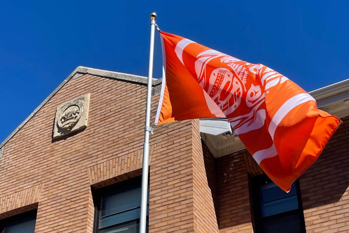 Orange survivor flag blowing in the wind.