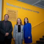 Dr. Ed Jurkowski, Vanessa Koldinges and Susan Hinds stand in front of new sign.