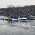 The rivgen turbine sits in the waters of the Winnipeg river.