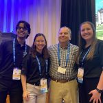 Members of the Biomedical Design Team stands smiling and posing for the camera.