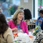 Staff and faculty around a table at the recent Long Service Awards.