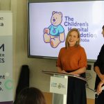 Mandy Archibald and Leslie Roos speak at a media conference.