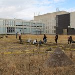 community participating in community planting in the front lawn of the John A. Russell Building