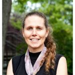 woman with ponytail and scarf outside in the summer