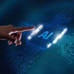 Photo of hand with finger pointing to AI button.