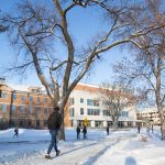 Winter, people walking outside the Tier Building at Fort Garry campus