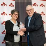 Michele Rogalsky accepting the 2022 Wilson Loree Award from Wilson Loree.