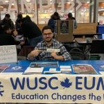 Man at WUSC recruitment booth.