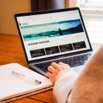 Over the shoulder image of a person on a laptop using UM Connect