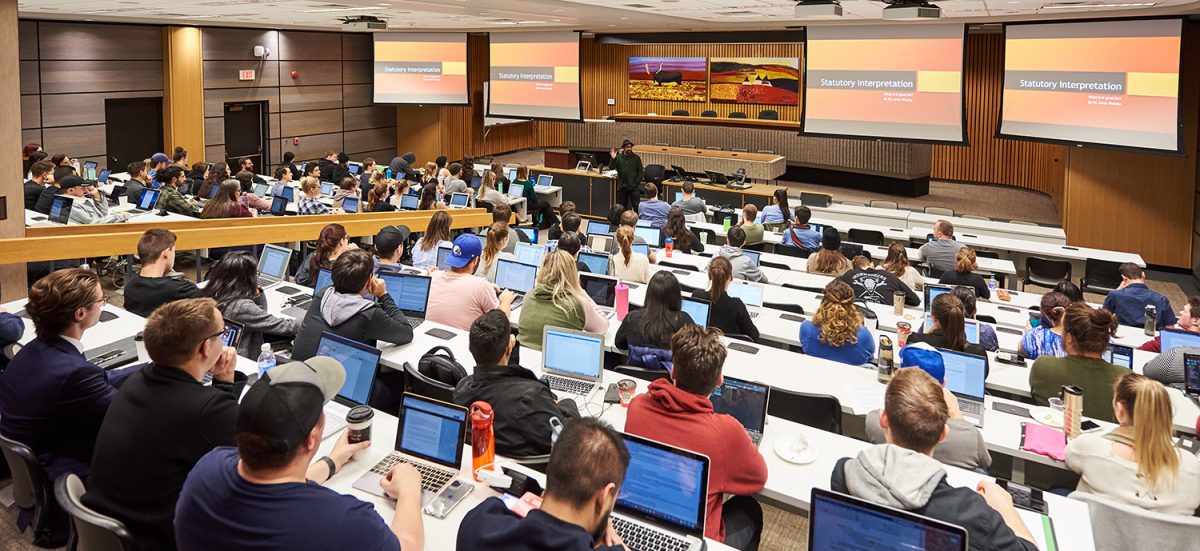 Robson Hall Moot Courtroom full of students with class in progress