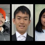 Student bursary recipients look straight ahead.