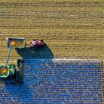 Aerial photo of a tractor during harvest season.