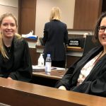 Sarah Sharp (3L) (left) and Aiyana McKenzie (3L) (right) take a moment mid-moot at the 2023 MacIntyre Cup trial advocacy moot held in Calgary. Photo by Chantal Boutin.
