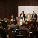 Members of Keystone Agricultural Producers raise their hands to vote