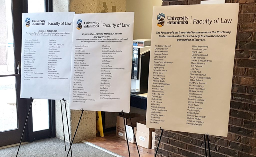 poster boards on easels listing Jurists and Practicing Professionals