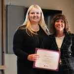 Laurie Schnarr, Vice-Provost (students) and Makenna Coldwell Engineering Student and 2024 Student Affairs Participation Award recipient, stand for a photo on stage with the award.
