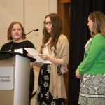 3 people presenting at the Students' Teacher Recognition Reception.