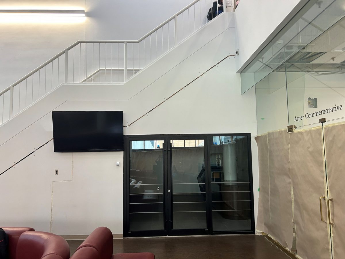 The new café with a dark door showing ongoing construction.