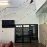 The new café with a dark door showing ongoing construction.