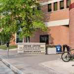 outside of drake centre featuring building sign and entryway