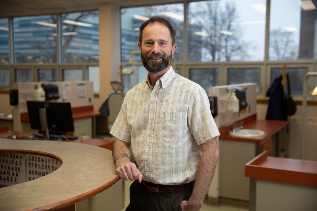 Portrait of Dr. Dieter Schönwetter standing in a dental clinic.