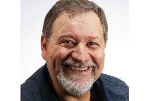 portrait of man with beard smiling at the camera
