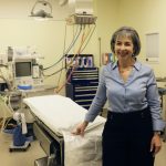 Dr. Carla Cohn stands in an operating room.