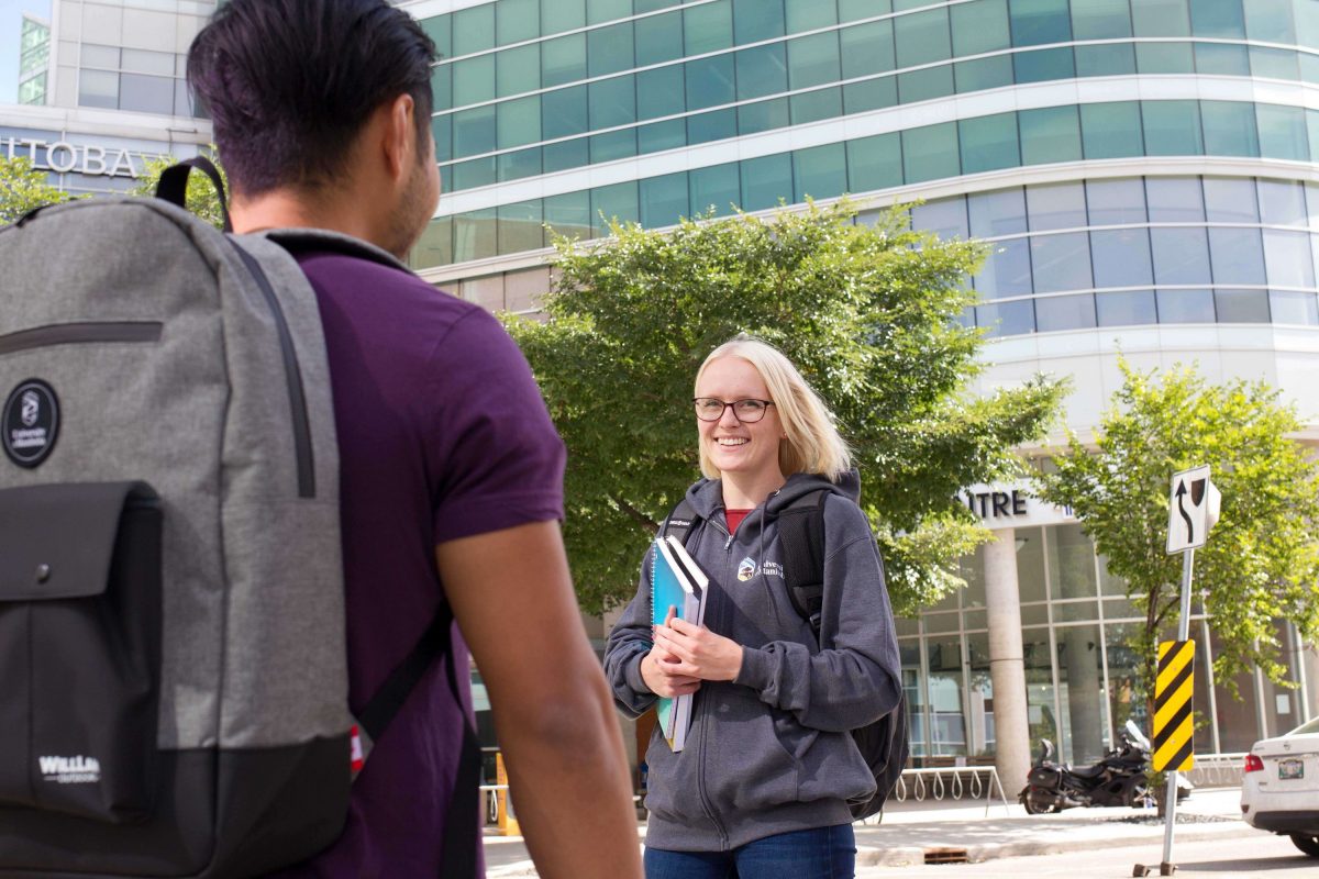 Student walking in front of Brodie Centre, Bannatyne campus