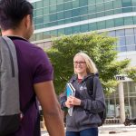 Student walking in front of Brodie Centre, Bannatyne campus