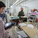Instructor and student exploring the FabLab in the Faculty of Architecture