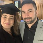 Photo of graduate and her partner.