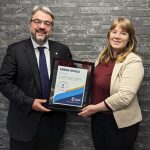 Dean Bruno Silvestre and Alexa Harwood-Jones, Asper Green Office Team lead holding the Green Office certification