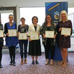 group of TLC graduates smiling for a posed photograph