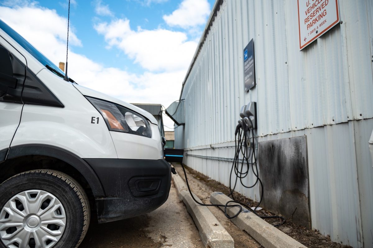UM-owned electric van at a fleet charging station.