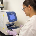 Researcher works with equipment