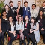 A group of 14 students dressed in business clothes.