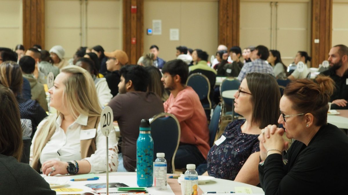 Attendees at Better Together listening to a presenter