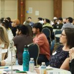 Attendees at Better Together listening to a presenter