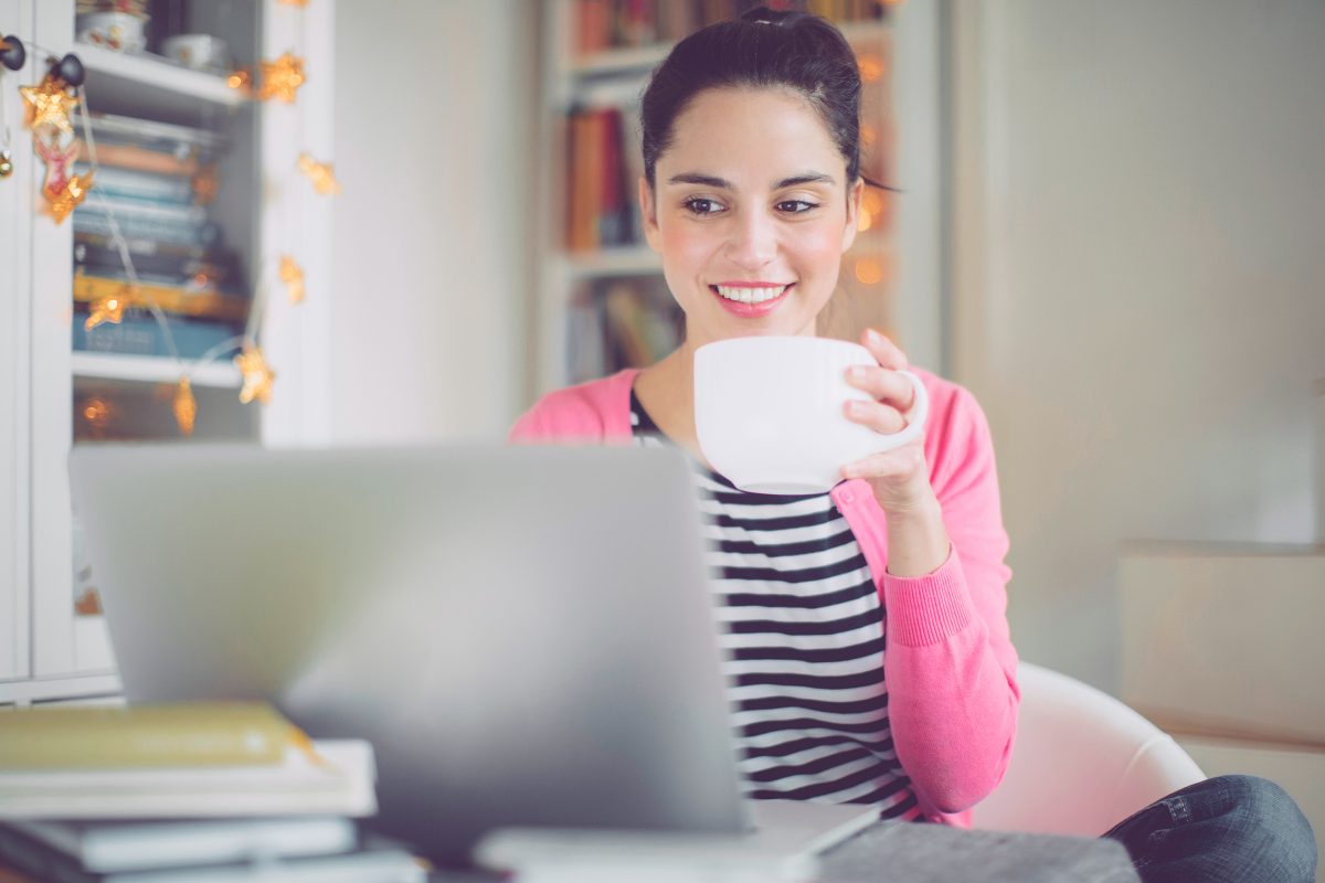 lady working on laptop with coffee