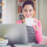 lady working on laptop with coffee