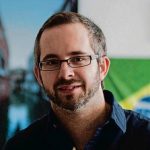 men using glasses and a blue shirt