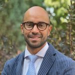 Outdoor headshot of Gustavo Castaneda.