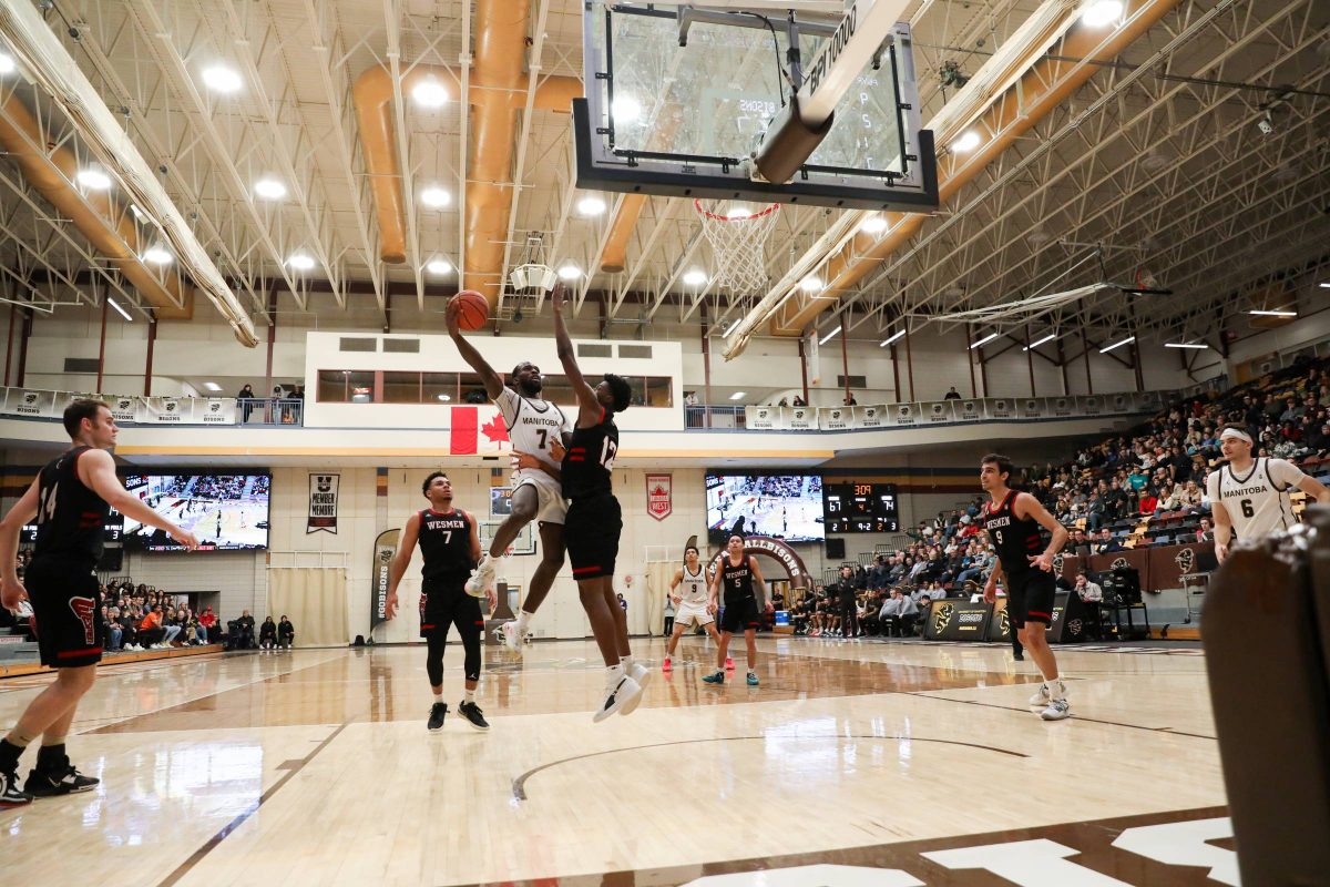 bisons basketball plays goes for a layup