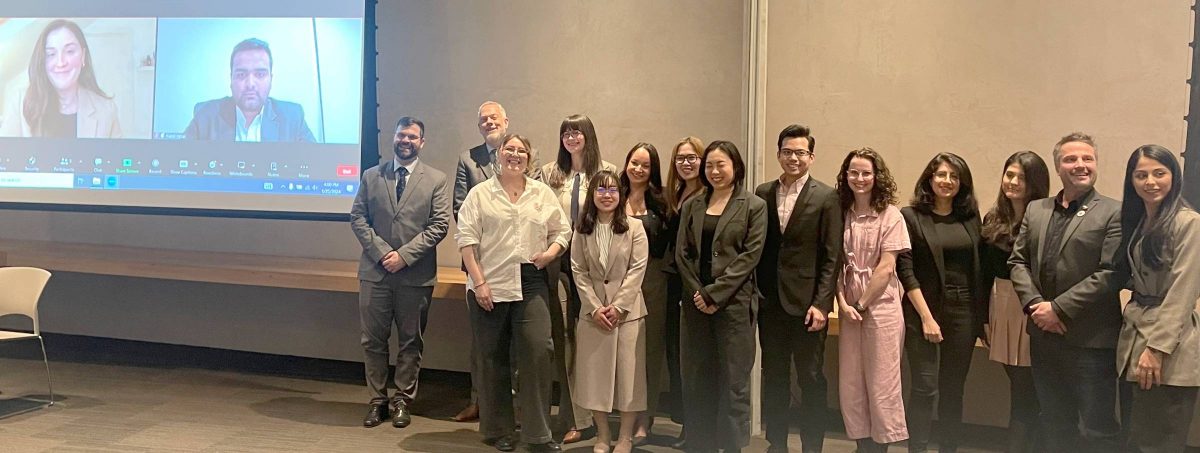 Master of Human Rights program students who just presented their practicum prapers and thesis reports pose for a group photo
