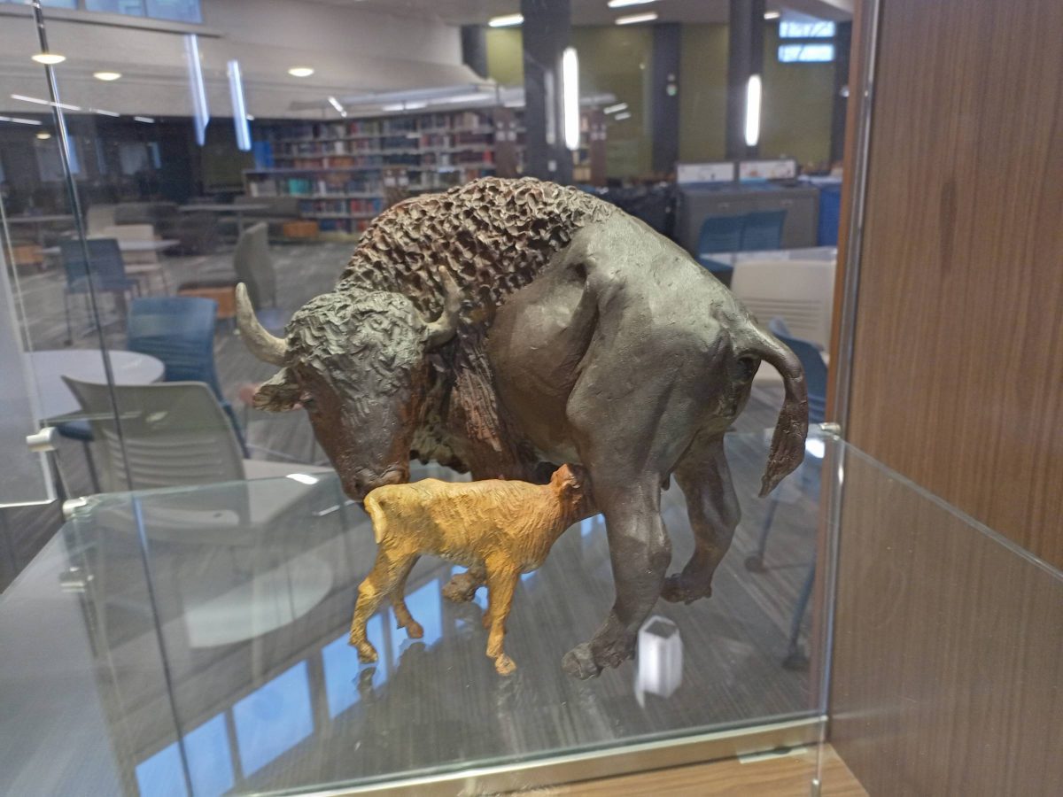 TLC, a painted bronze sculpture of a female bison and her calf.