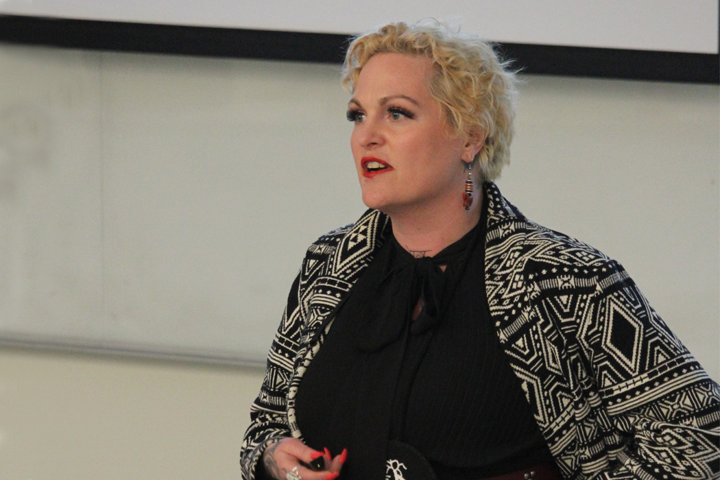 Stephanie Van Haute speaking at a conference.