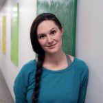 Dr. Laura Bowler stands in a hallway at the University of Manitoba.