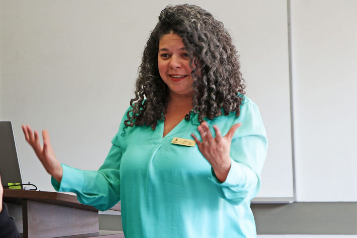 Cintia Costa teaching a workshop